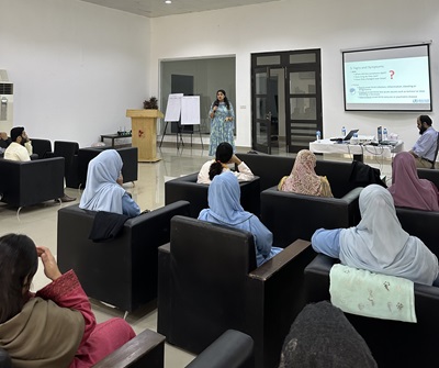 people sitting in armchairs during a presentation